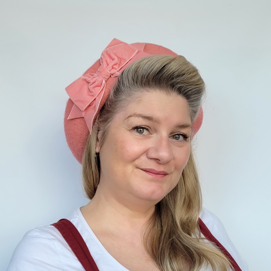 Coral Pink Beret with Pink Velvet Ribbon Bow worn by a white woman in her 40s with long blonde hair