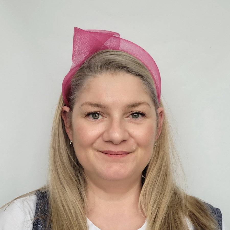 Dark Pink Crinoline Knot Headband worn by a model in her 40s with long blonde hair