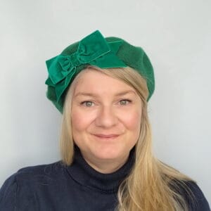 Emerald Green Beret with Green Velvet Ribbon Bow worn by a white woman in her 40s with long blonde hair