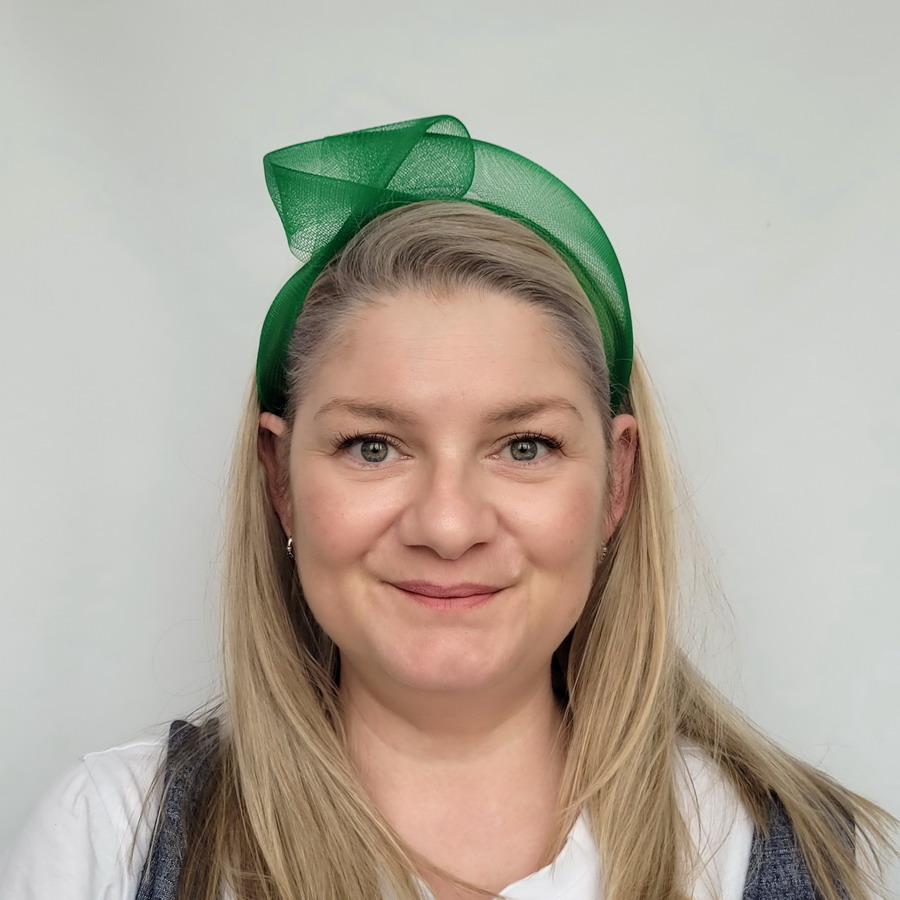 Emerald Green Crinoline Knot Headband worn by a model in her 40s with long blonde hair