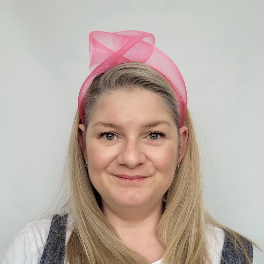 Fuchsia Pink Crinoline Knot Headband worn by a model in her 40s with long blonde hair