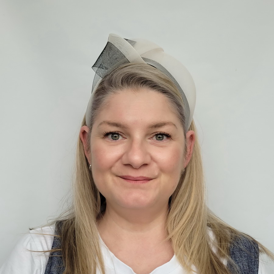 Ivory Black Crinoline Knot Headband worn by a model in her 40s with long blonde hair