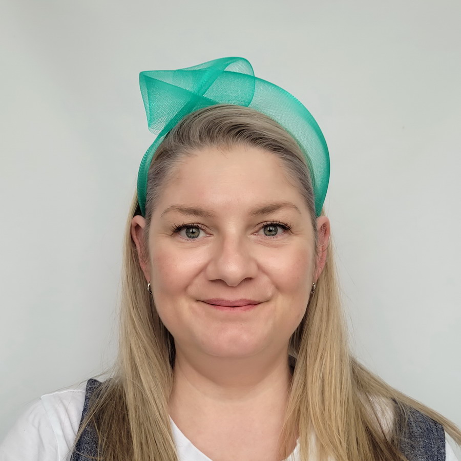 Jade Green Crinoline Knot Headband worn by a model in her 40s with long blonde hair