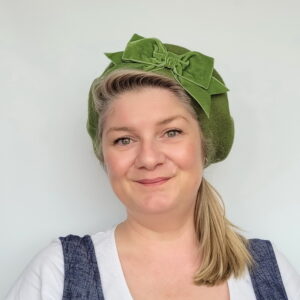 Moss Green Beret with Green Velvet Ribbon Bow worn by a white woman in her 40s with long blonde hair