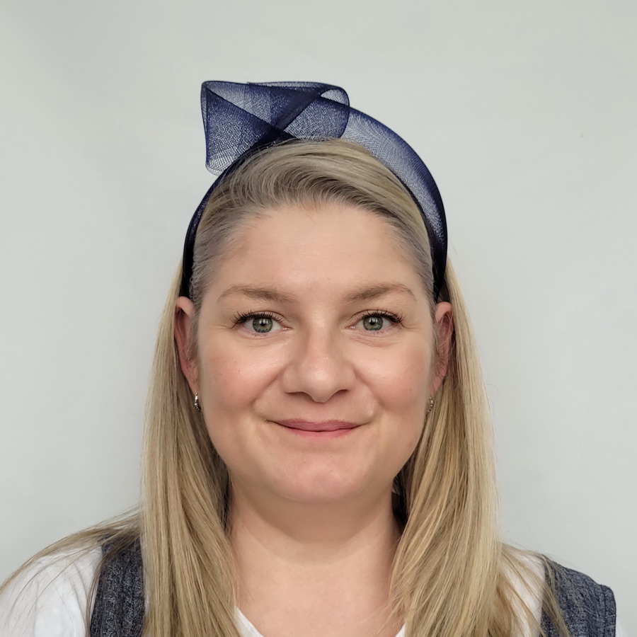 Navy Blue Crinoline Knot Headband worn by a model in her 40s with long blonde hair