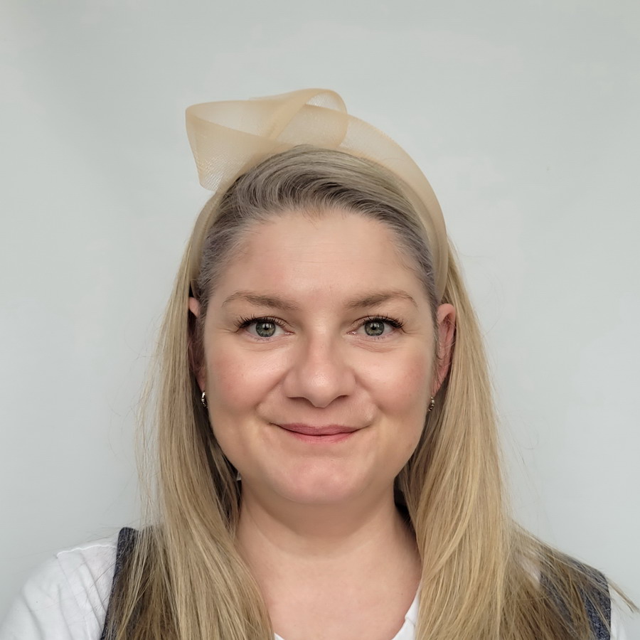 Pale Gold Crinoline Knot Headband worn by a model in her 40s with long blonde hair