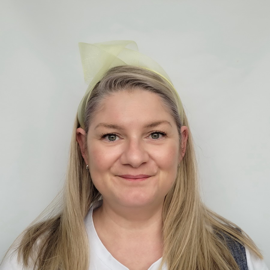 Pale Yellow Crinoline Knot Headband worn by a model in her 40s with long blonde hair