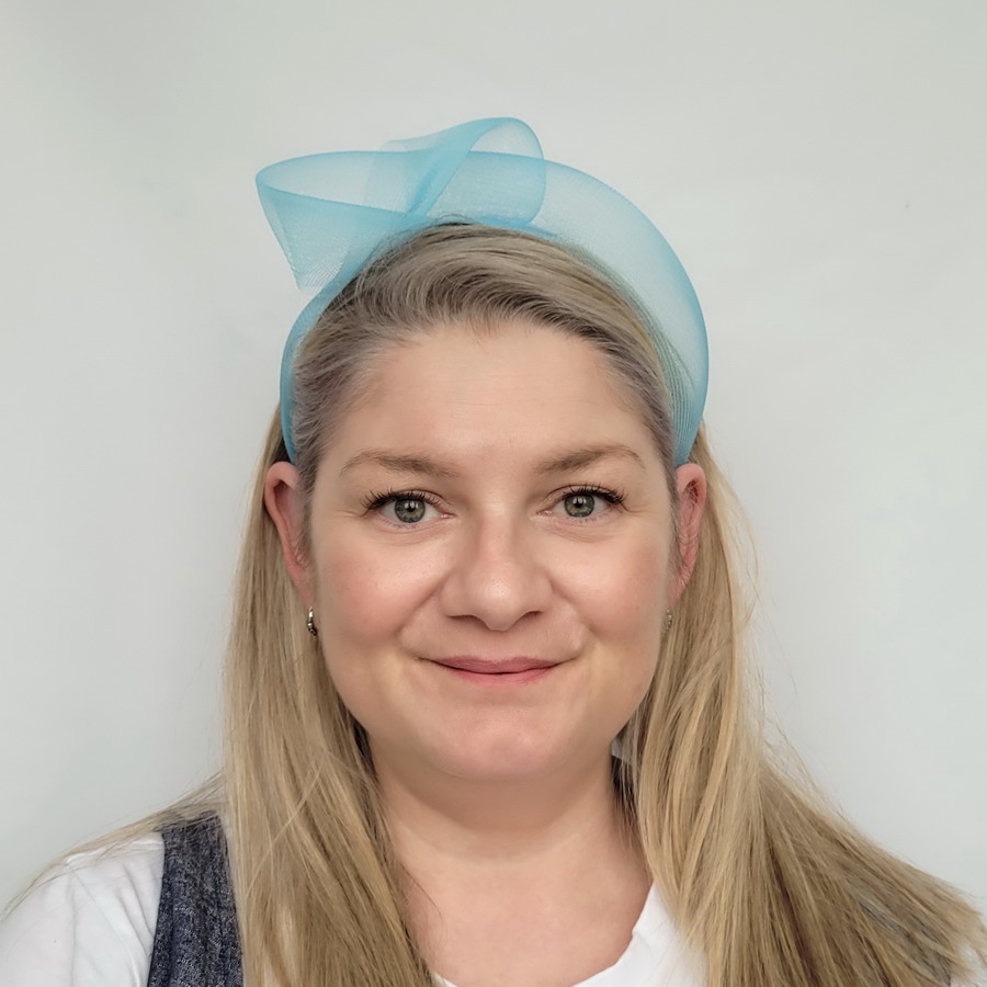Peacock Blue Crinoline Knot Headband worn by a model in her 40s with long blonde hair