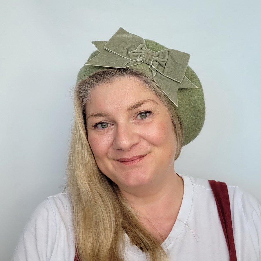 Sage Green Beret with Green Velvet Ribbon Bow worn by a white woman in her 40s with long blonde hair