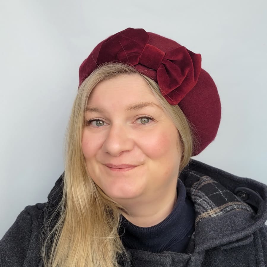 Wine Red Beret with Wine Velvet Bow worn by a white woman in her 40s with long blonde hair