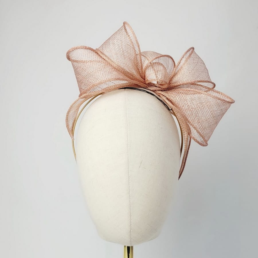 Gold Looped Fascinator Headband worn to the left of the head