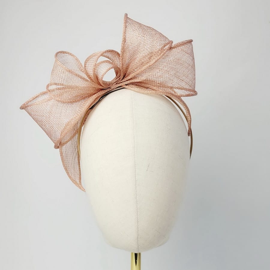 Gold Looped Fascinator Headband worn to the right of the head