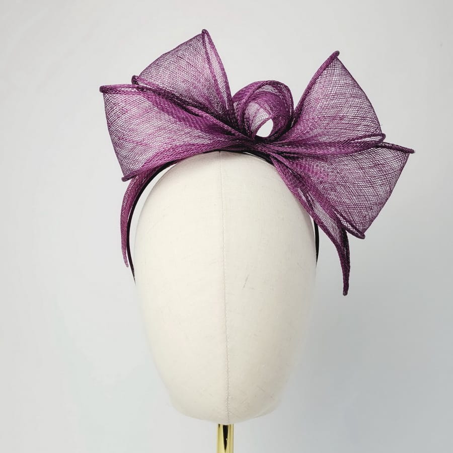 Plum Purple Looped Fascinator Headband worn to the right of the head