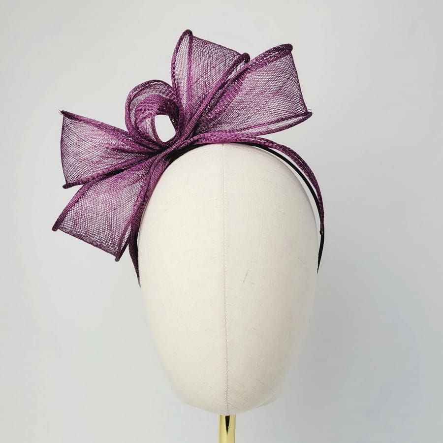 Plum Purple Looped Fascinator Headband worn to the right of the head