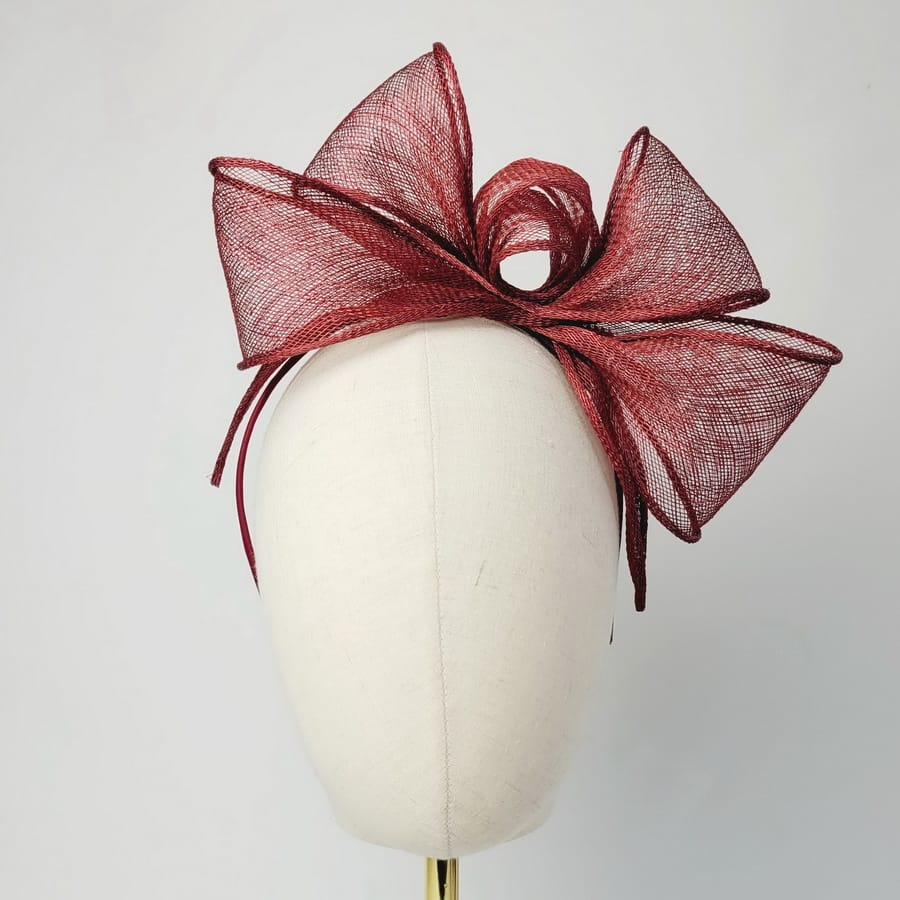 Wine Red Looped Fascinator Headband worn to the left of the head