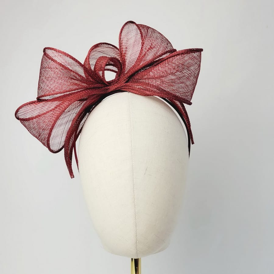 Wine Red Looped Fascinator Headband worn to the right of the head