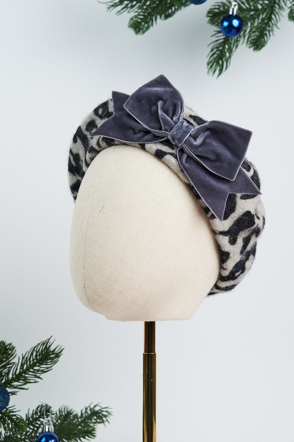 Shop the New AW22 Beret Collection featuring this Grey Leopard Print Wool Felt Beret with a hand sewn Grey Velvet Ribbon Bow made by Imogen's Imagination